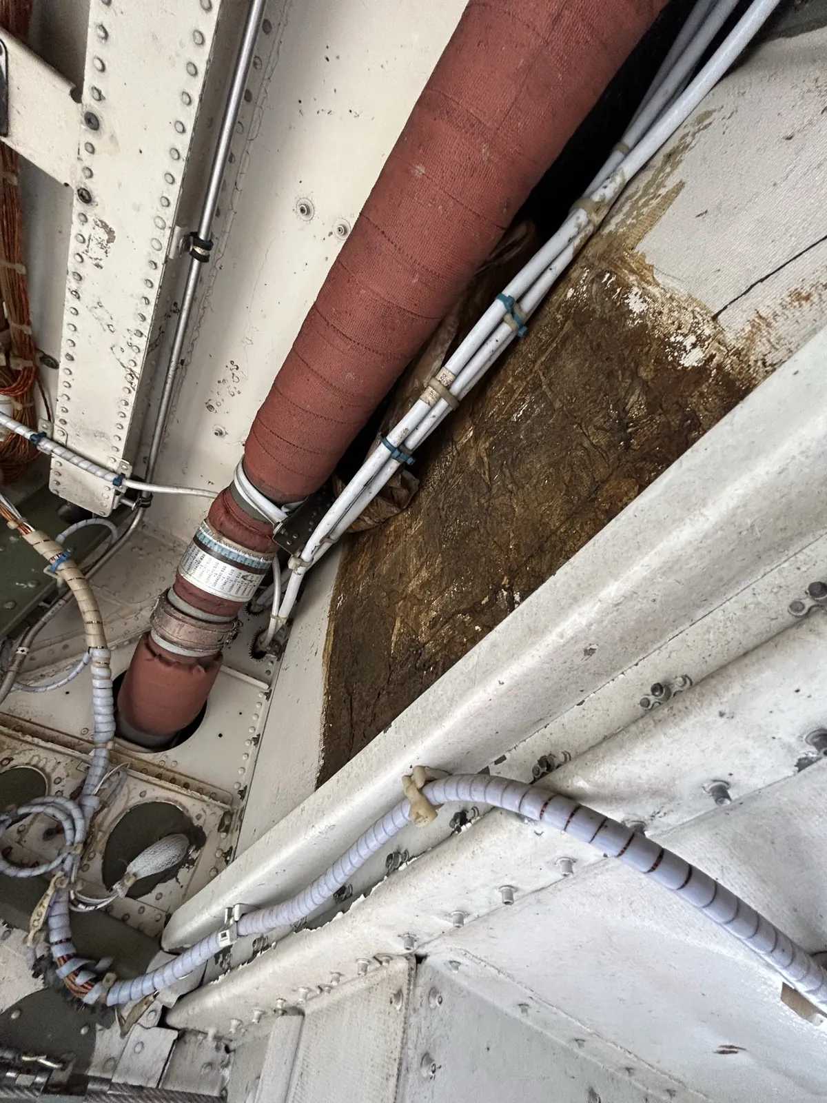 Duct and wiring inside a wheel well